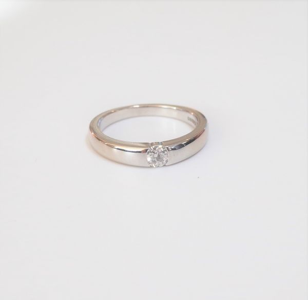 An 18ct white gold ring, mounted with a circular cut diamond, ring size K, gross weight 4.2 gms with a case.