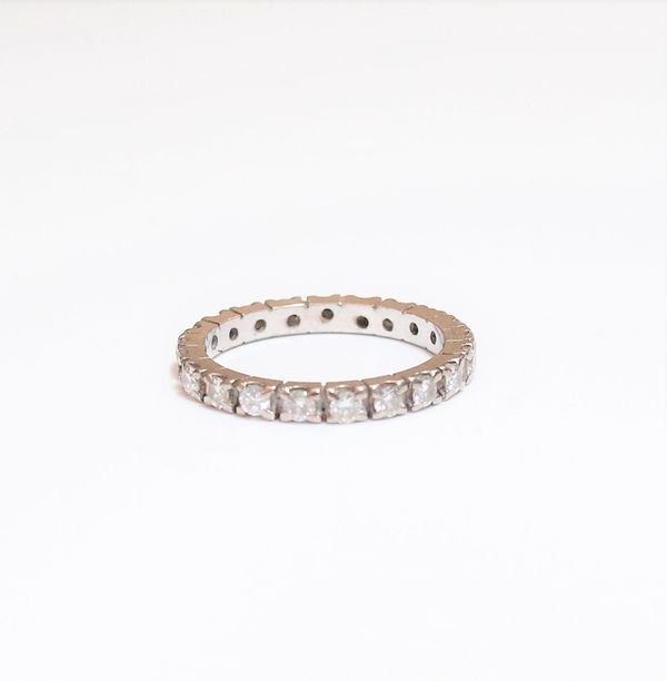 A diamond set full eternity ring, mounted with circular cut diamonds (two diamond lacking), ring size I and a half, gross weight 2.4 gms.