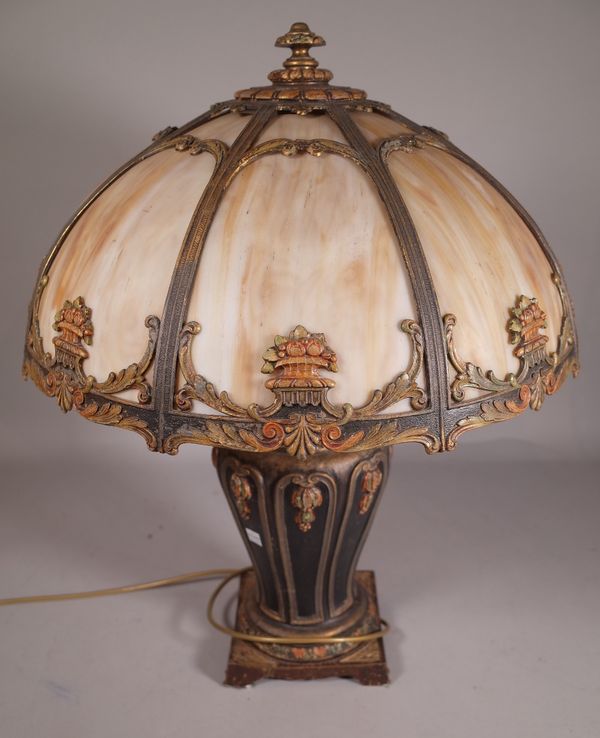 A Tiffany style composite metal lamp of urn form, and matching glass shades.