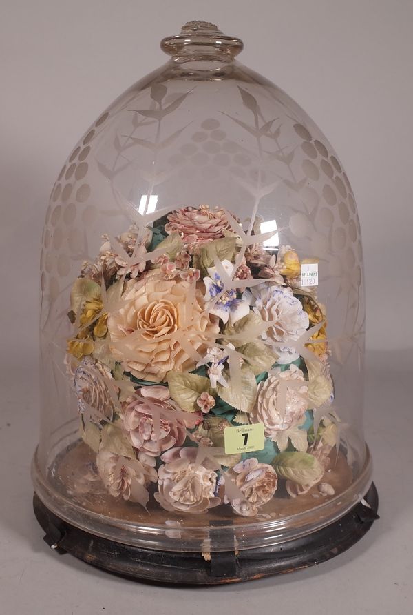 A 20th century glass klosch containing floral display, 44cm high.