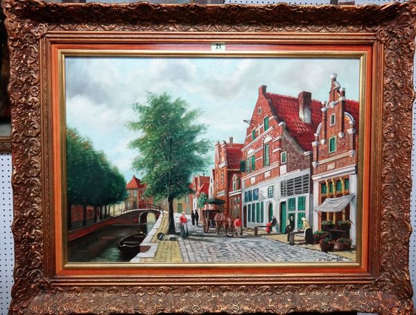 H. J. Topman (20th century), A Dutch canal side street, oil on canvas, signed, 49cm x 68cm.