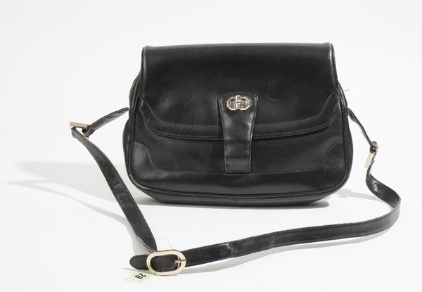 A Gucci style black leather lady's handbag with gilt metal hardware and adjustable shoulder strap, 32cm wide. 6409