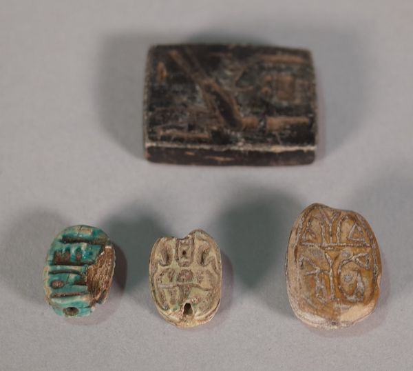 Four Egyptian carvings comprising; three scarabs and a small rectangular tablet, 2.5cm, (4).