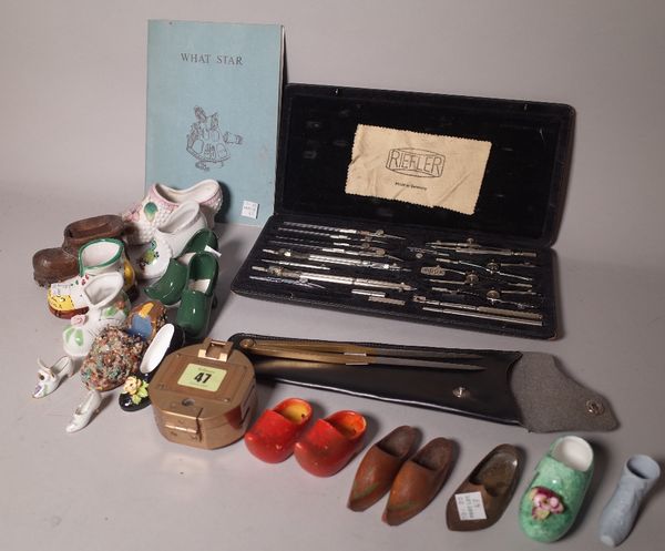 A group of mostly 19th century porcelain models of shoes, a set of cased balance scales, a Stanley brass compass and sundry, (qty).