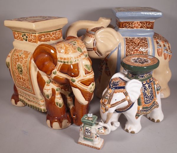 A group of four Asian style pottery elephants of varying sizes, the largest 43cm high, (4).