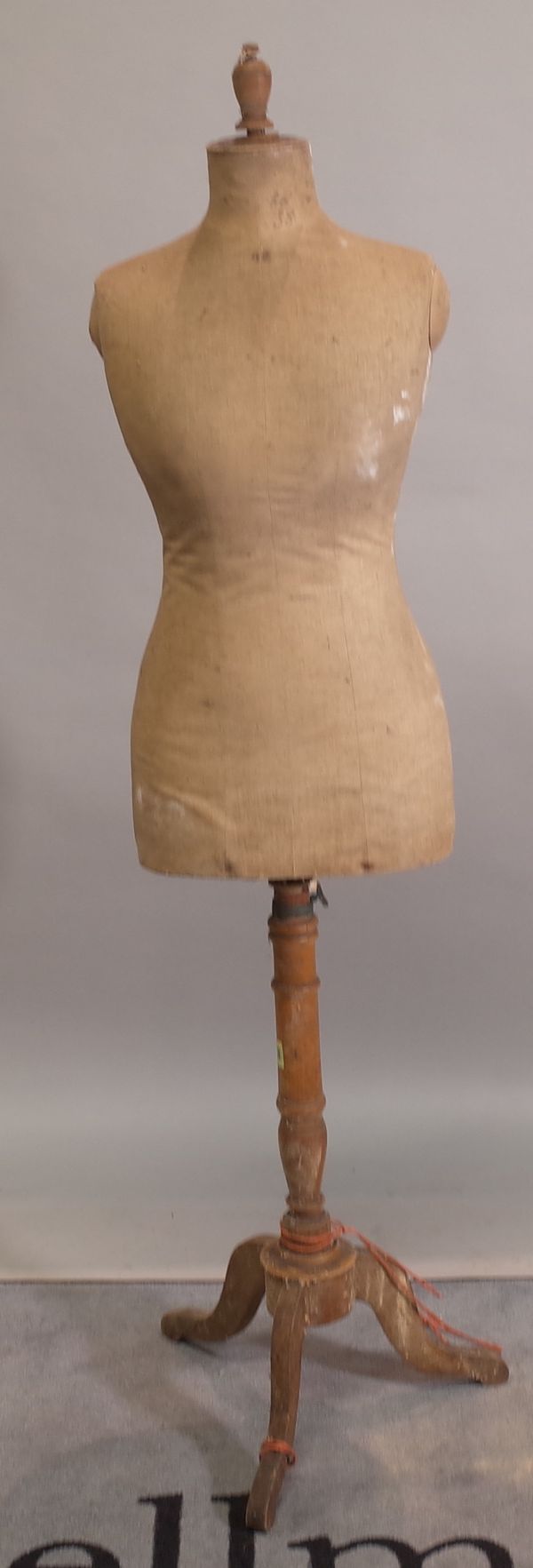 An early 20th century mannequin dummy on mahogany tripod stand, 160cm high.