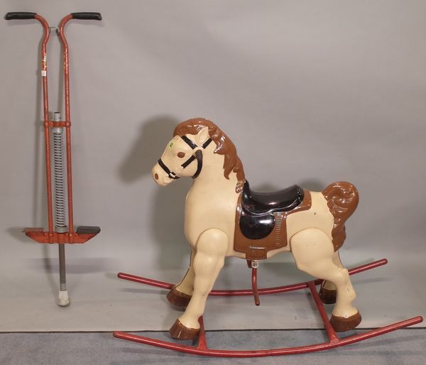 An early 20th century painted rocking horse and a vintage po-go stick, 105cm wide x 68cm high, (2).