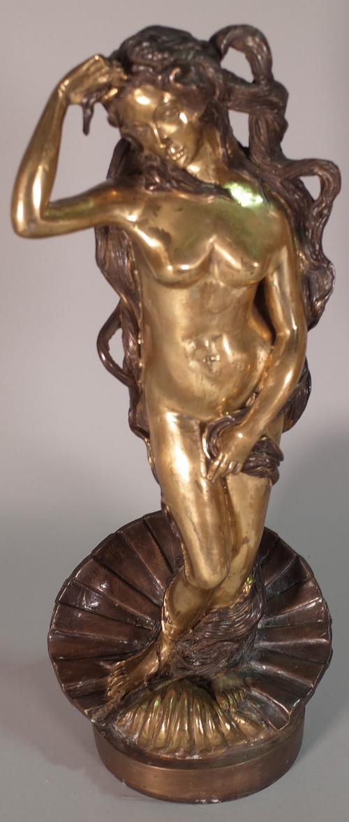 A 20th century bronze figure of a nude female, on a circular plinth base, 43cm high.