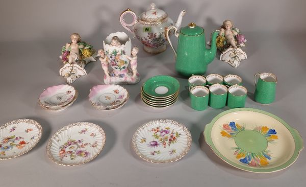 Porcelain, including; a Continental tea pot, pair of Continental wall pockets, Dresden saucers, a Clarice Cliff plate, a cherub vase, a green Fortnum