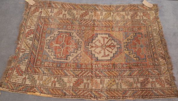 A Shirvan rug with three medallions, leaf and tulip border, 148cm x 96cm.