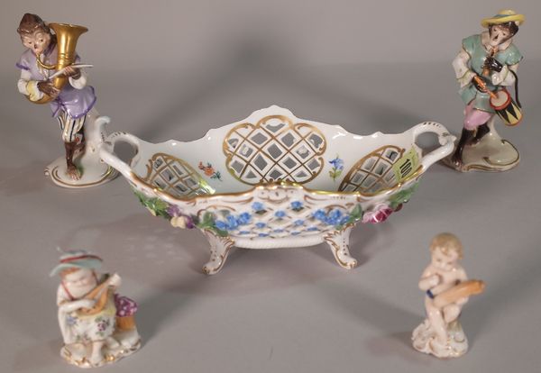 A pair of Naples porcelain monkey bound figures (15cm high), two smaller Naples porcelain figures and a Dresden two handled basket, with a pierced fol