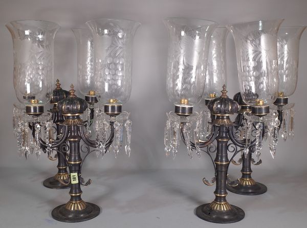 A group of four Victorian style table lights, with etched glass shades, 56cm high.