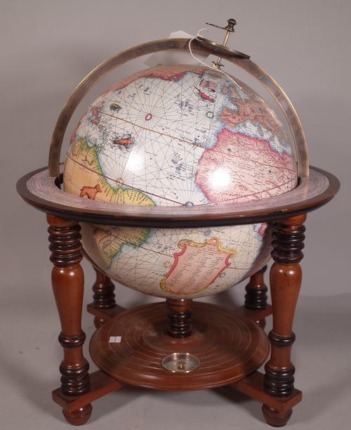 A 20th century table top globe, on stained beech stand, 52cm high.