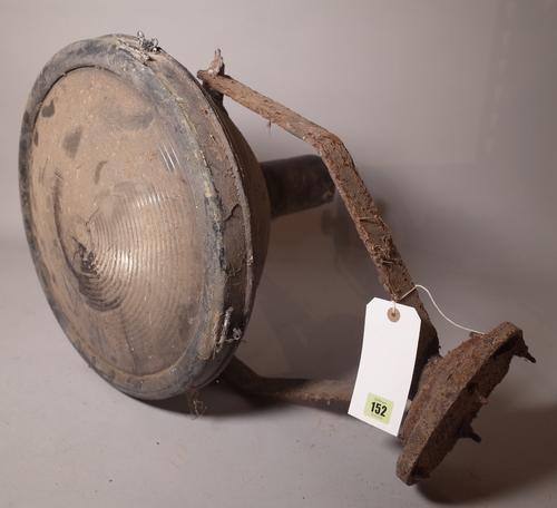 An early 20th century large pedestal lamp, possibly a nautical search light.