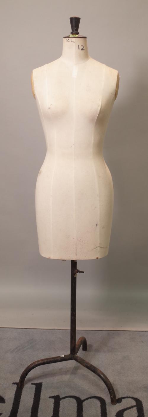 A 20th century female mannequin torso on metal base, 160cm high.