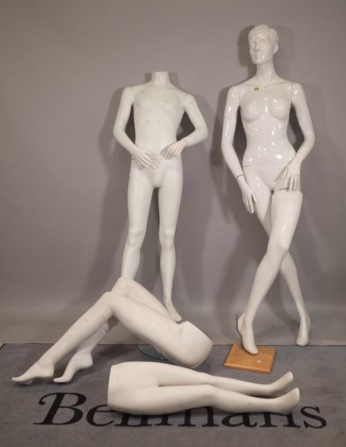 A 20th century full body female mannquin, a child mannequin, 130cm high and two sets of legs, the largest 90cm high, (4).