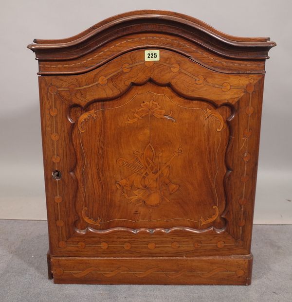 An Edwardian 19th century inlaid mahogany arch topped music cabinet with panelled door on plinth base, 53cm wide x 65cm high.