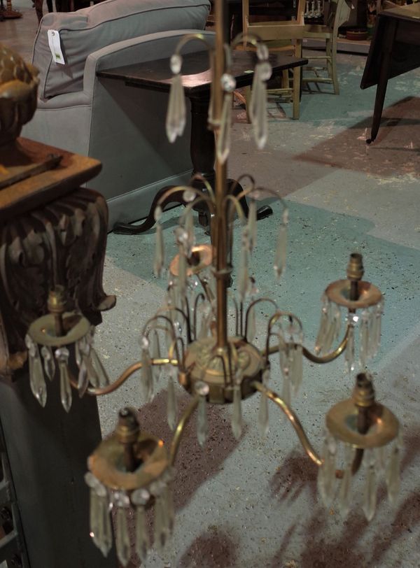 A gilt metal five branch chandelier with glass drops, 70cm high.