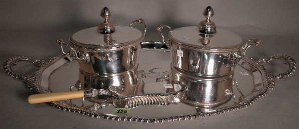 Silver plated wares, including; an oval twin handled serving tray, two lidded entree dishes and a crumb scoop, (4).