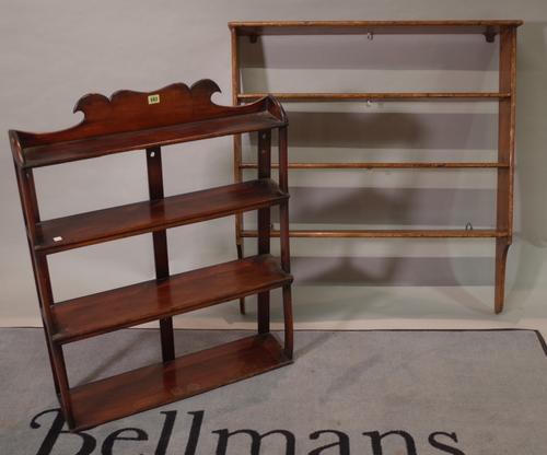 A late Victorian mahogany four tier hanging shelf, 75cm wide x 96cm high, and a later pine hanging shelf, 102cm wide x 109cm high, (2).