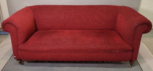 An early 20th century mahogany framed two seater sofa with roll over arms and red upholstery, 200cm wide x 75cm high, and another similar sofa with dr