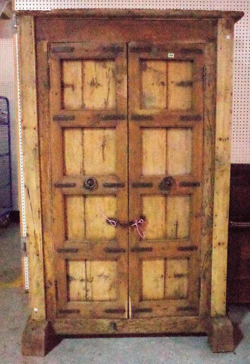 An early 20th century Indian hardwood two door side cupboard, 127cm wide x 200cm high.