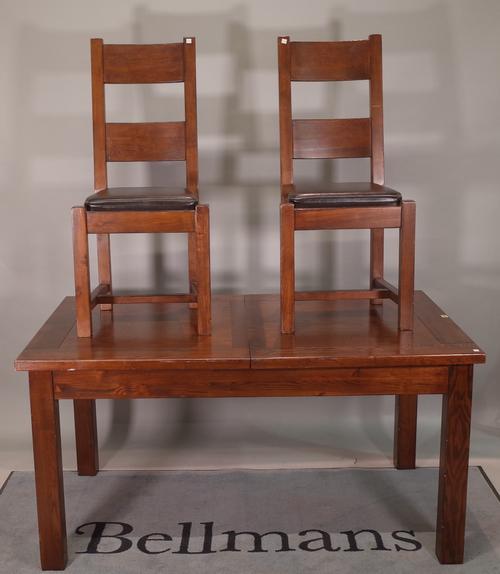 A 20th century oak extending dining table with one integral leaf, 152cm wide x 78cm high x 191cm fully extended and a matching set of eight bar back d