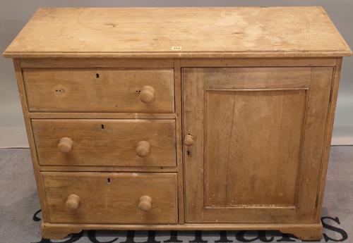 An early 20th century pine side cabinet with three short drawers, 112cm wide x 82cm high.