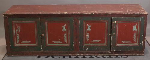 An early 20th century painted low sideboard with four panelled doors, 186cm wide x 61cm high.
