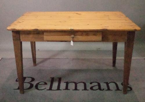 An early 20th century pine and elm kitchen table with single drawer on tapering square supports, 115cm wide x 71cm high.