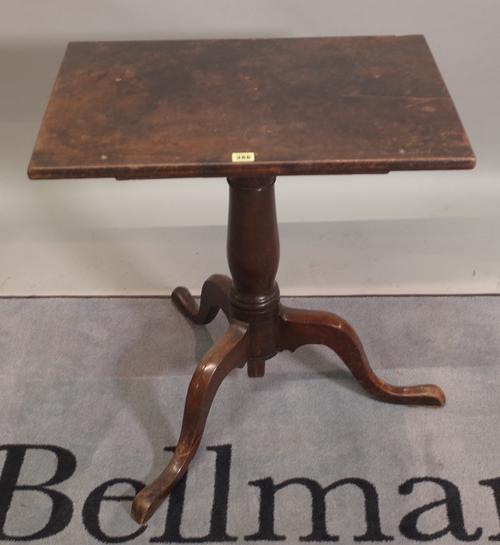A George II and later mahogany height adjustable tripod table with rectangular top on three downswept supports, 65cm wide x 71cm high (lowest).