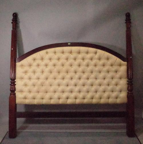 A William IV and later mahogany upholstered headboard with reeded column supports, 194cm wide x 197cm high.