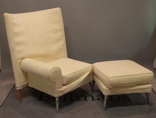 A 20th century hardwood framed high back corner armchair with cream suede upholstery, 80cm wide x 115cm high, and matching footstool, 60cm wide x 43cm