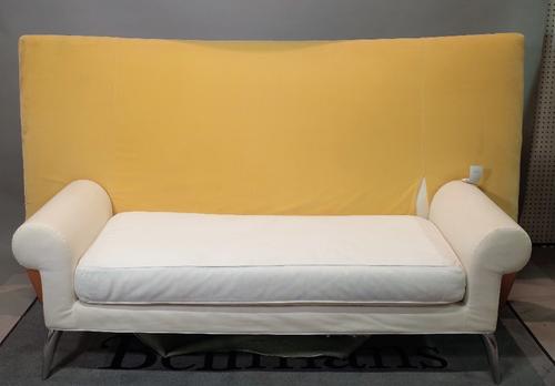 A 20th century hardwood framed high back window seat with roll over arms on chrome tapering supports, 170cm wide x 105cm high.