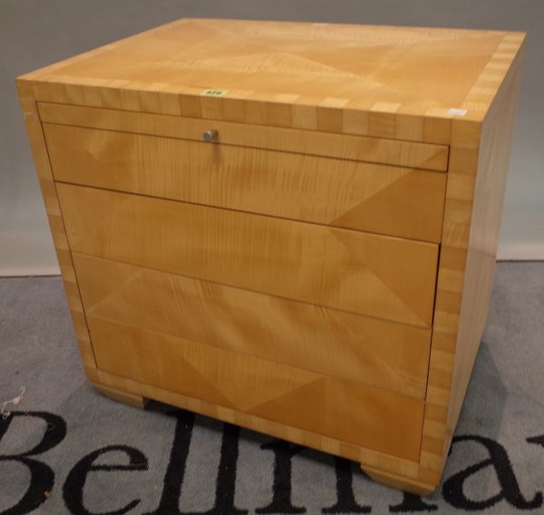 A 20th century maple four drawer low chest on bracket feet, 61cm high x 63cm wide.