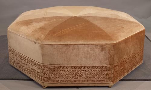A Robert Kime camel upholstered octagonal centre stool with Stella Coombes velvet upholstery, 130cm wide x 40cm high.