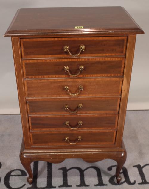 An early 19th century mahogany six drawer music cabinet on cabriole supports, 55cm wide x 87cm high.