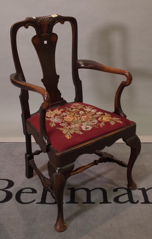 A George III style mahogany open armchair on cabriole pad feet, 57cm wide x 103cm high.