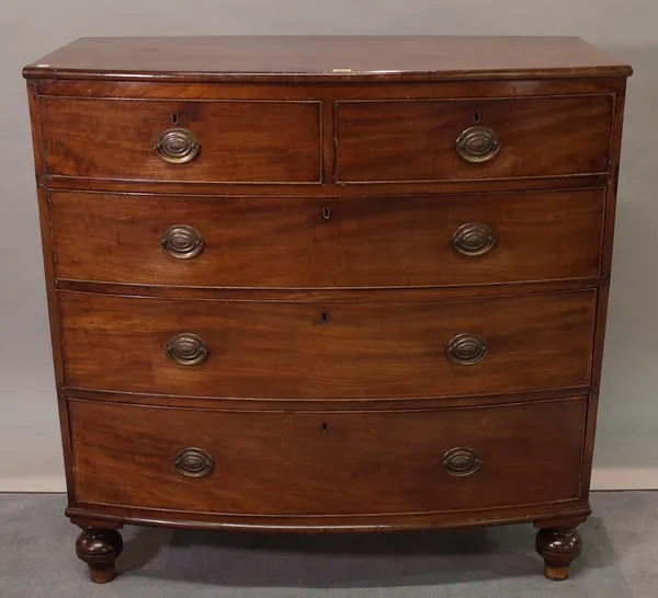 A Regency mahogany bowfront chest, with two short and three long graduated drawers on bun feet, 108cm wide x 108cm high.