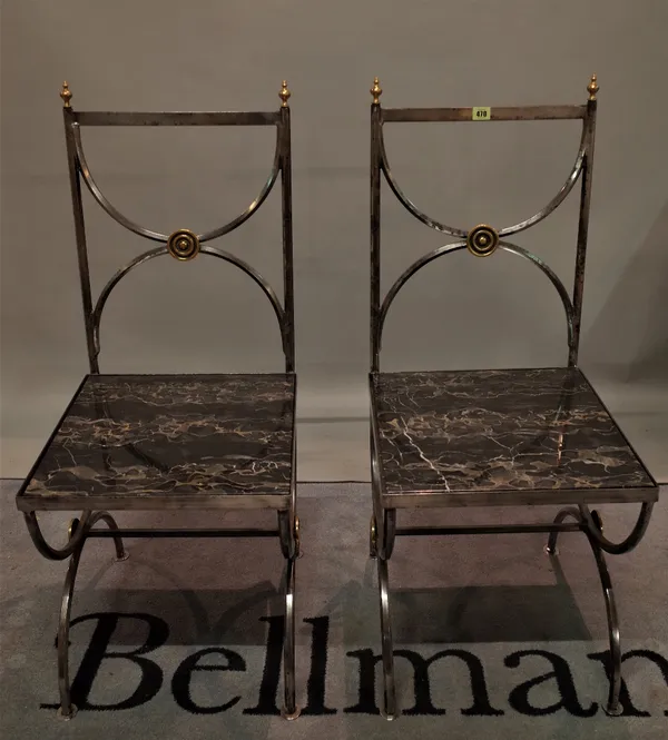 A pair of 20th century steel hall chairs with inset marble seats, 47cm wide x 105cm high, (2).