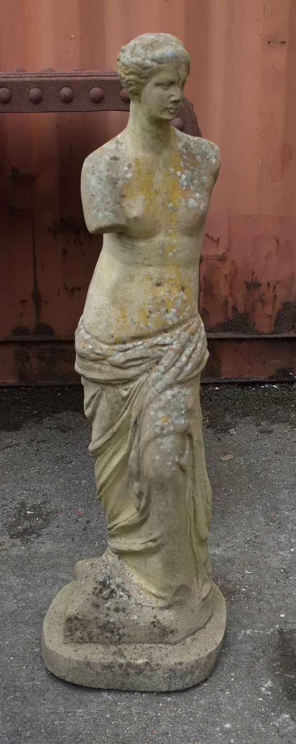 An early 20th century reconstituted stone female figure in standing pose, 97cm high.