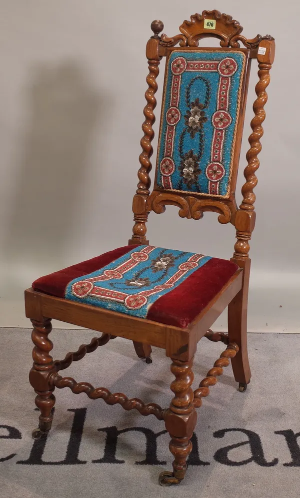 A 19th century walnut prie-dieu with beadwork upholstery, 41cm wide x 101cm high.