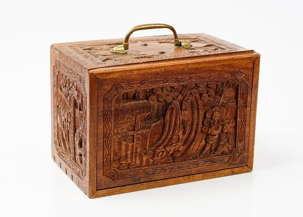 An early 20th century Chinese bone and bamboo Mahjong set in a carved hardwood case fitted with five drawers, 26cm wide x 17.5cm high x 17cm deep.