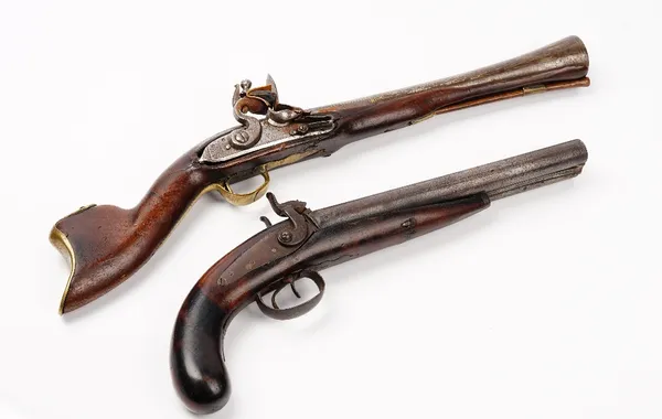 A 19th century Near Eastern flintlock blunderbuss pistol, possibly Turkish, with damascened barrel and engraved steel lockplate, barrel diameter 4cm,