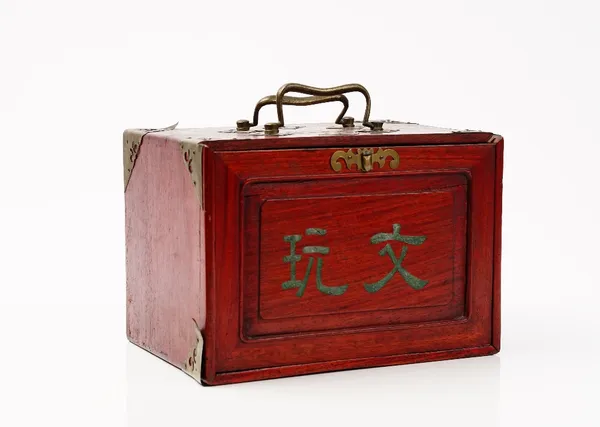 A 20th century Chinese bone and bamboo Mahjong set in a red stained wood case fitted with five drawers, 24cm wide.