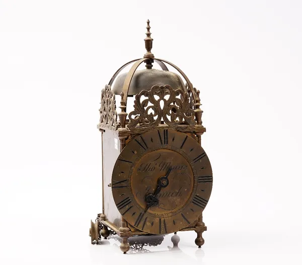 An 18th century style brass lantern clock, the dial signed 'Thomas Moore Ipswich', 37cm high, one weight, pendulum and later oak bracket.