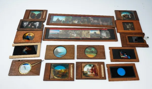 A collection of approximately fifty coloured magic lantern slides, including some with moving actions, topographical scenes and flowers.