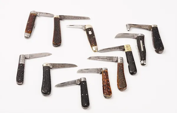 A group of eleven pocket knives, mostly bone handled, including examples by I.XL George, Joseph Rodgers & Sons and Walker & Hall, (11).