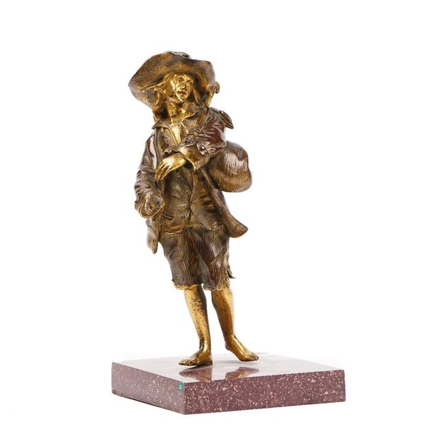 French school, a late 19th century parcel gilt bronze figure of peasant standing holding bagpipes, on a square rouge griotte marble plinth, unsigned,