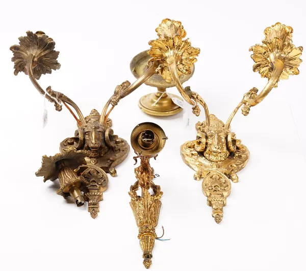 A pair of early 20th century gilt metal twin branch wall lights, decorated with ram's masks, 35cm high, a single branch wall light and a brass door ha